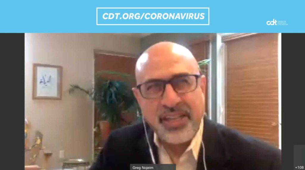 Screenshot of Greg Nojeim, CDT's Senior Counsel and Director of the Freedom, Security and Technology Project, in his home, wearing a jacket and glasses, while discussing gaps in U.S. privacy and surveillance law during our April 30, 2020 webinar.