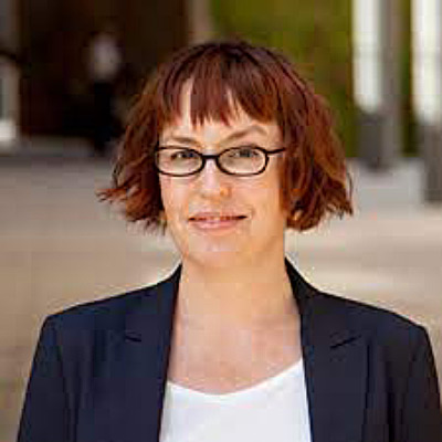 Daphne Keller. Stanford Center for Internet and Society. Wearing glasses, a white shirt and a dark suit.