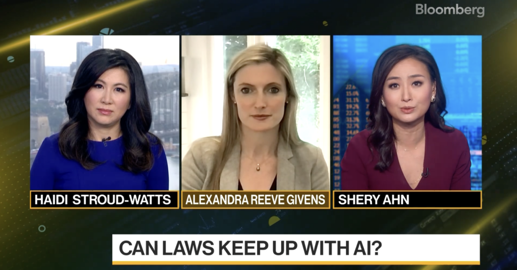 A screenshot of CDT CEO Alexandra Givens appearing on "Bloomberg Daybreak: Australia" to discuss AI regulation. Alex is in the center window wearing a light colored suit jacket.