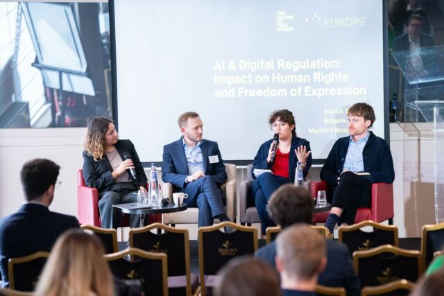 Photograph of four speakers, including CDT Europe’s Laura Lazero Cabrera at far left, appearing onstage on a panel on the AI Act’s implications for human rights. 
