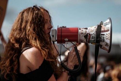 Women with bullhorn.