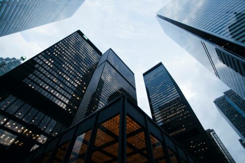 Photograph of skyscrapers against an overcast sky