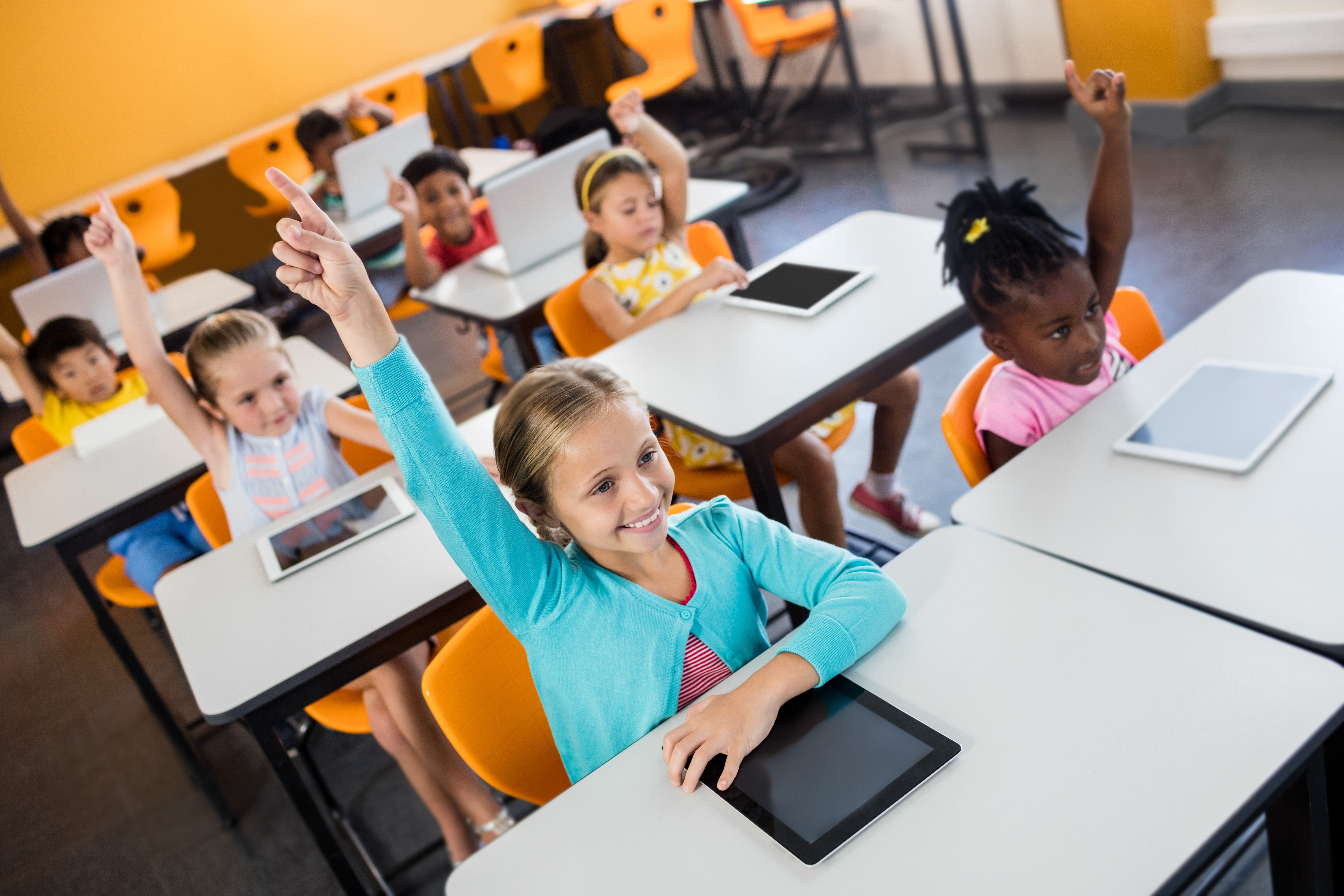 Pupils raising their hands