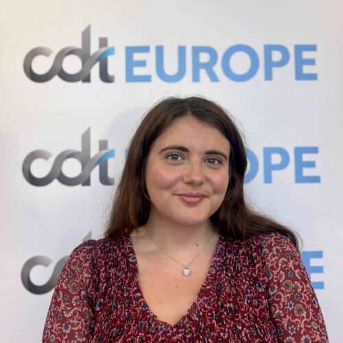 Giulia Papapietro standing in front of the CDT Europe logo banner