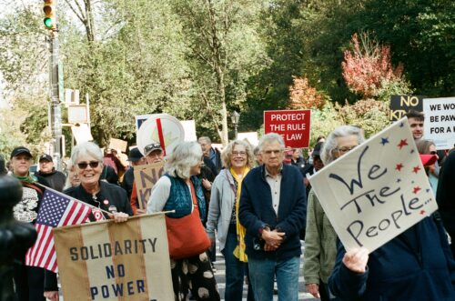 Image of people protesting with signs.