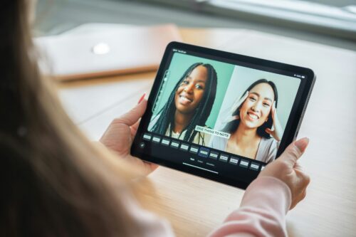 Kids faces on ipad screen.