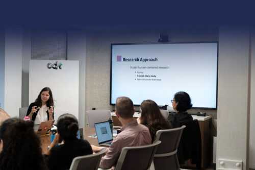 Photo from a CDT convening, with a CDT Research's Michal Luria talking to a room of people about CDT's research approach.