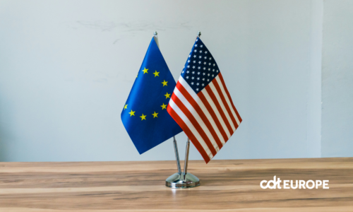 Two flags of EU and US on a table