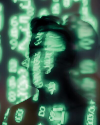 Face with shadow and green numbers.